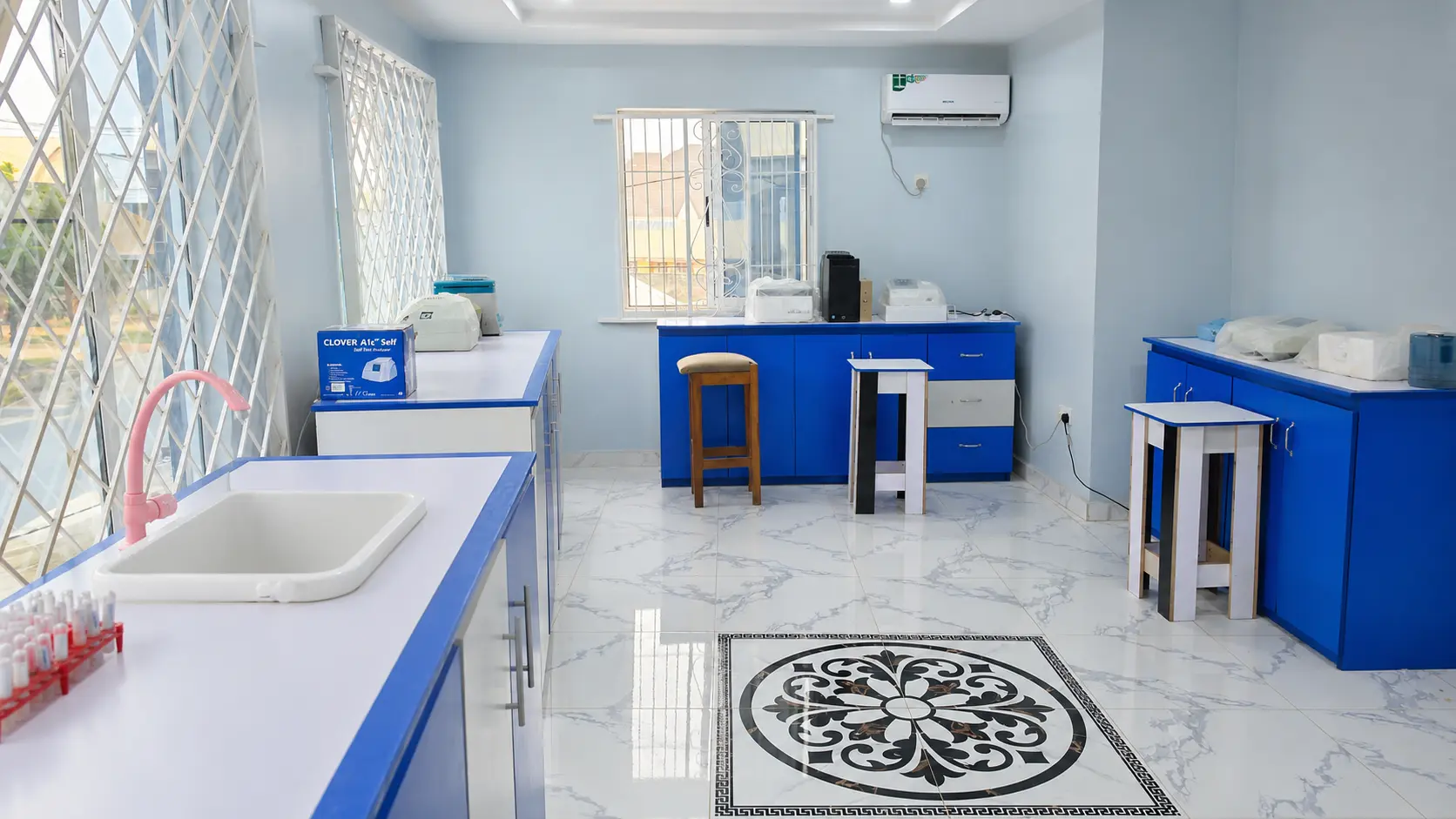 The clean blue-and-white laboratory interior at Delight Specialist Clinic